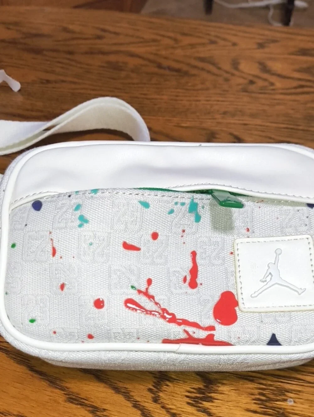 Jordan White Crossbody Bag with Red and Green Paint-Splash Accents